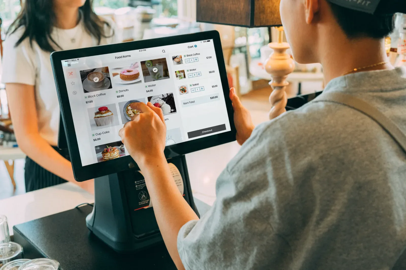 Restaurant point-of-sale terminal in use at a service counter